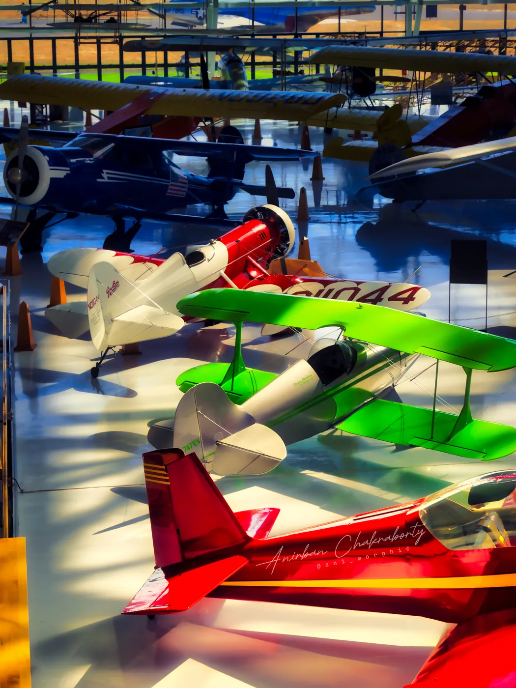 Aerobatic biplanes from the mezzanine, red and green and white