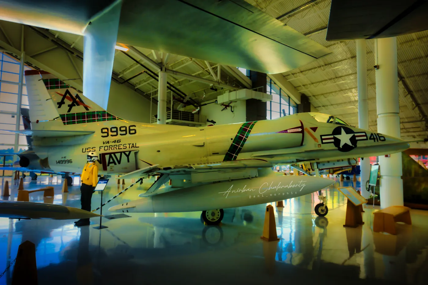A Skyhawk in Forrestal markings, tail high under the trusses