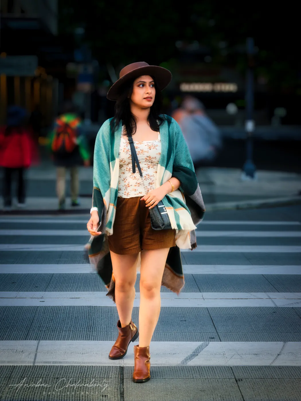 Crossing downtown on the white bars of the crosswalk