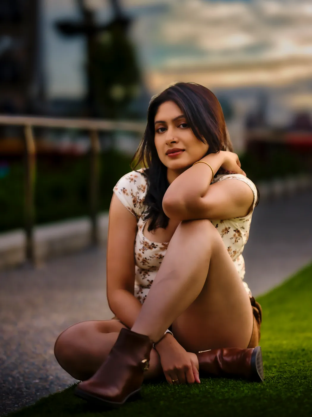 Sitting on a rooftop lawn at dusk